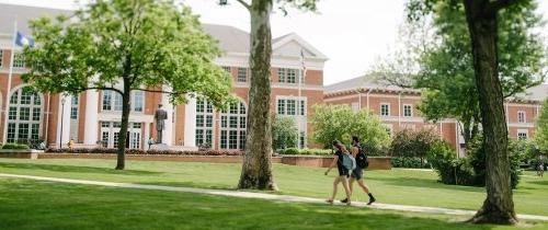 Students walking on the Centre College campus in front of Crounce Hall